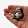 Kiss the frog silver broch with baroque pearl in a hand to show its size
