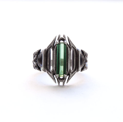 Giger inspired ring with green tourmaline baguette.