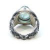organic chrysler building ring, blackened sterling silver, 24k golf foil fused to the silver, oval aquamarine cab. Back