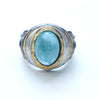 organic chrysler building ring, blackened sterling silver, 24k golf foil fused to the silver, oval aquamarine cab. Front