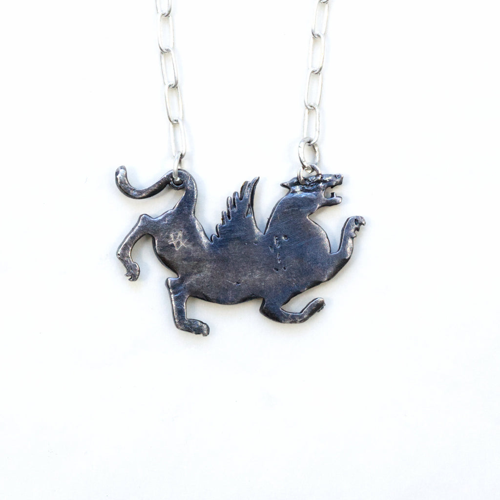 blackened silver and gold tiger with wings necklace. back