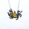 blackened silver and gold tiger with wings necklace. Front