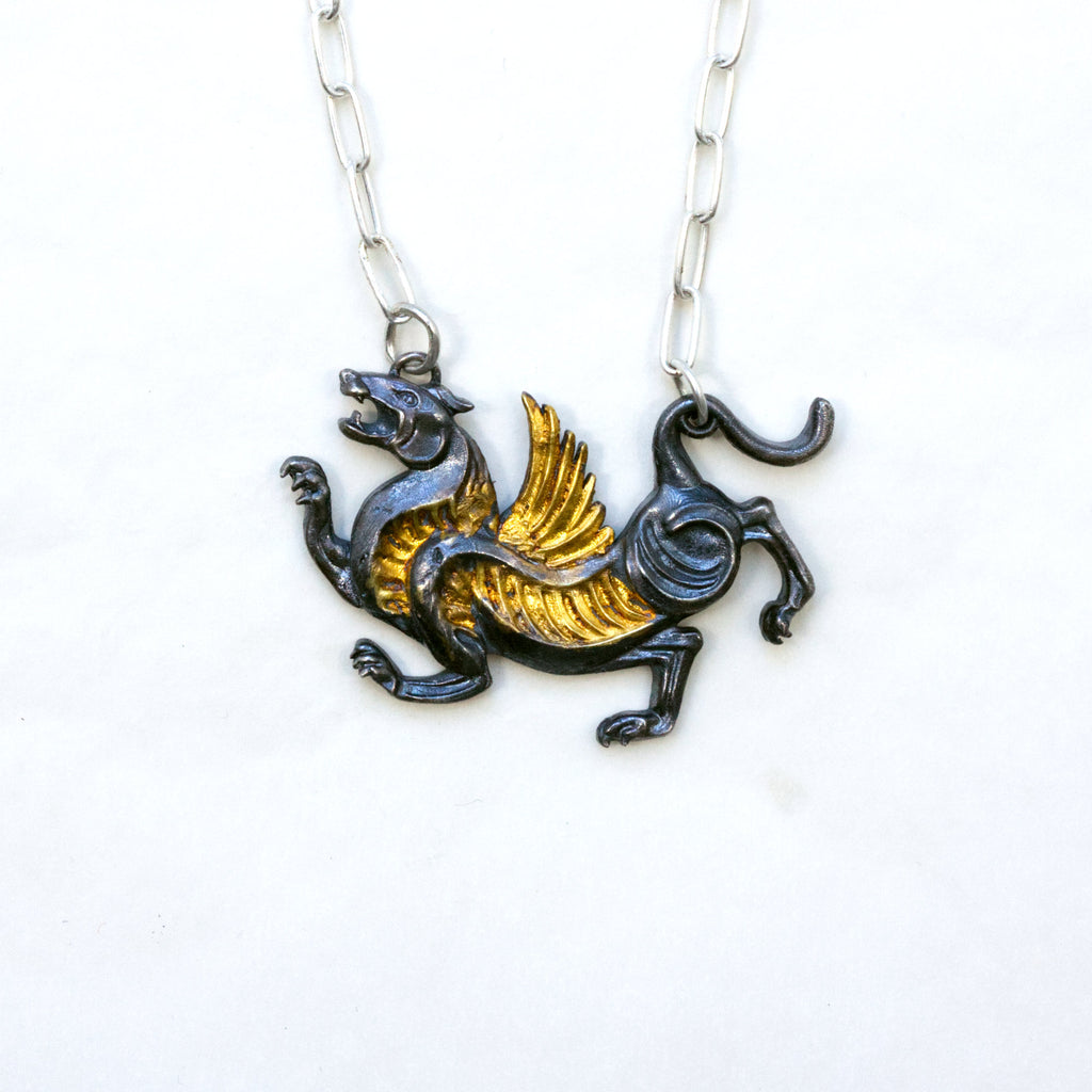 blackened silver and gold tiger with wings necklace. Front