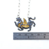 blackened silver and gold tiger with wings necklace. measure