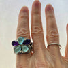 pentagon flower sterling silver ring with aquamarine and amethyst shown being worn