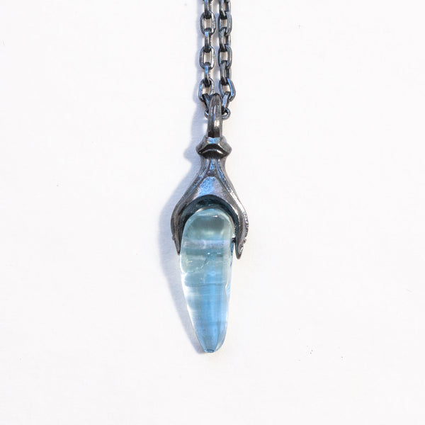 Blackened silver animal like pendant with an untreated aquamarine and 17" chain. front