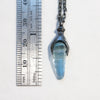 Blackened silver animal like pendant with an untreated aquamarine and 17" chain. Measure.