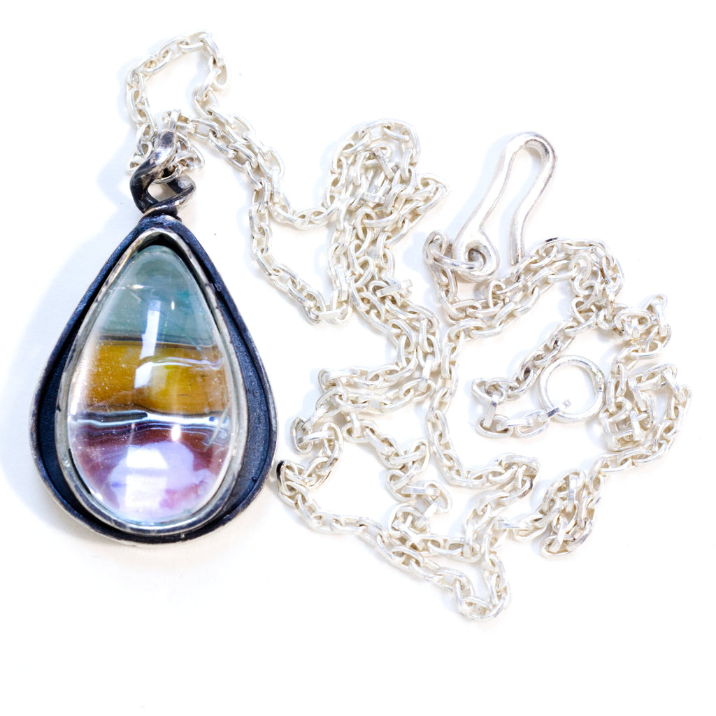 aquamarine teardrop, sterling silver necklace with green, yellow and red cabs underneath. With chain and clasp
