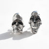 comedy and tragedy skull sterling silver earrings in a natural light