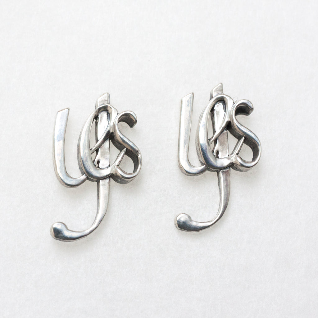 Decisive earrings, Yes--Sterling silver, long posts and big backs for comfort