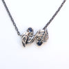 double silver bird with sapphire eyes necklace