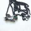 flying bird, silver with green tourmaline eye show with chain and hook clasp