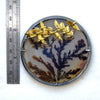 Round dendritic agate bush with golden swallows flying by. Brooch pendant. Front measure.