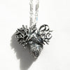 detailed anatomical heart pendant,  with a shadow-back