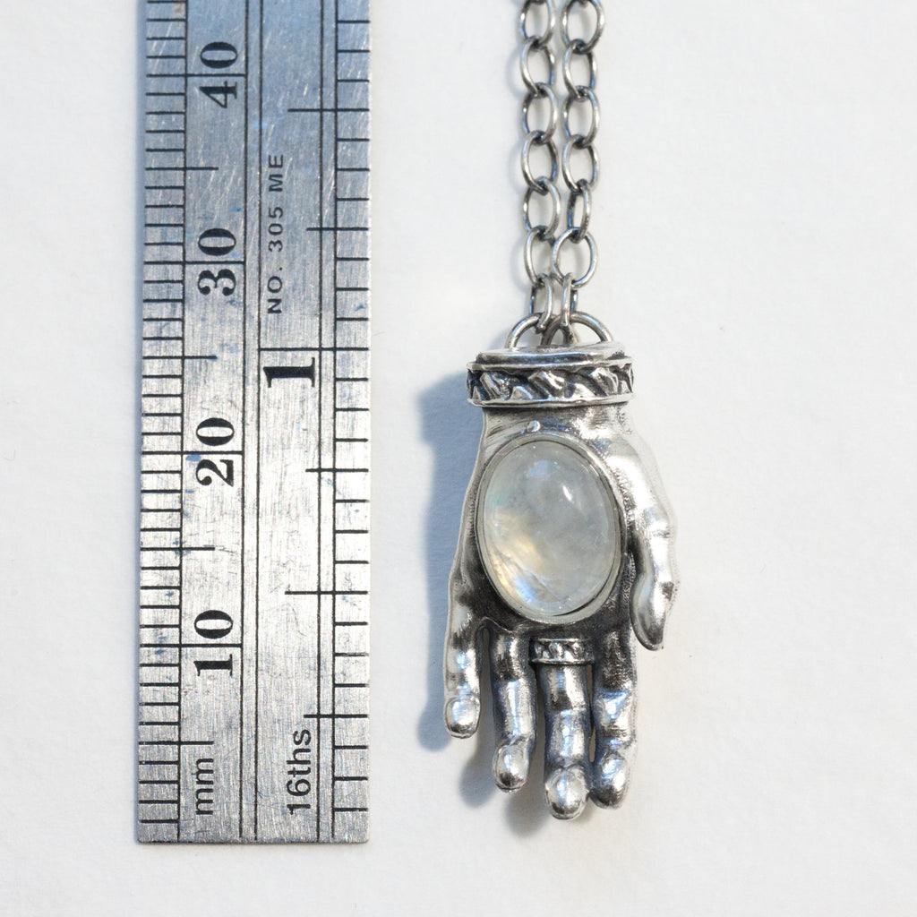 left offering and giving hand, silver with rainbow moonstones measure