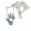 open offering silver left hand with rainbow moonstone and chain and clasp