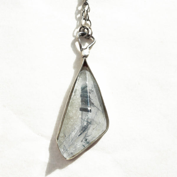 closeup of the quartz tourmaline silver necklace gemstone