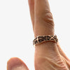 14k roes gold X band ring with the cross pattern on a finger to show size