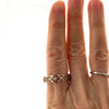 14k roes gold X band ring with the diamond pattern on a finger to show size