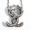 Twisting Love Snakes silver pendant with hidden hearts-front