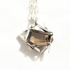 smokely quartz sterling silver necklace close up of the gemstone with a shadow