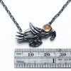 soaring bird blackened  silver with garnet eye measure