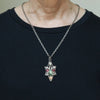 Stone face sterling silver pendant with tourmaline, agate, and prehnite shown being worn.