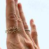 delicate lattice 10k gold ring, on finger, fornt and side.