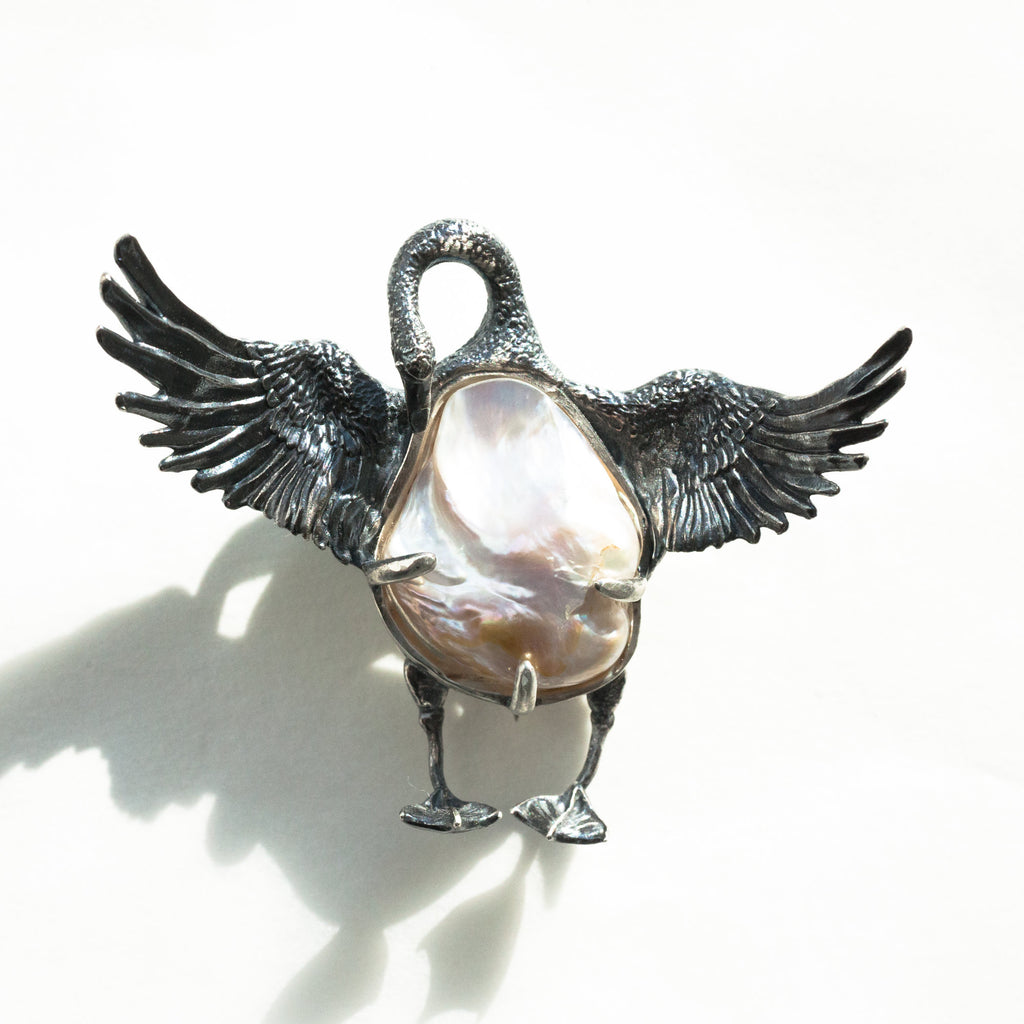 baroque pearl swan sterling silver brooch front view in strong light