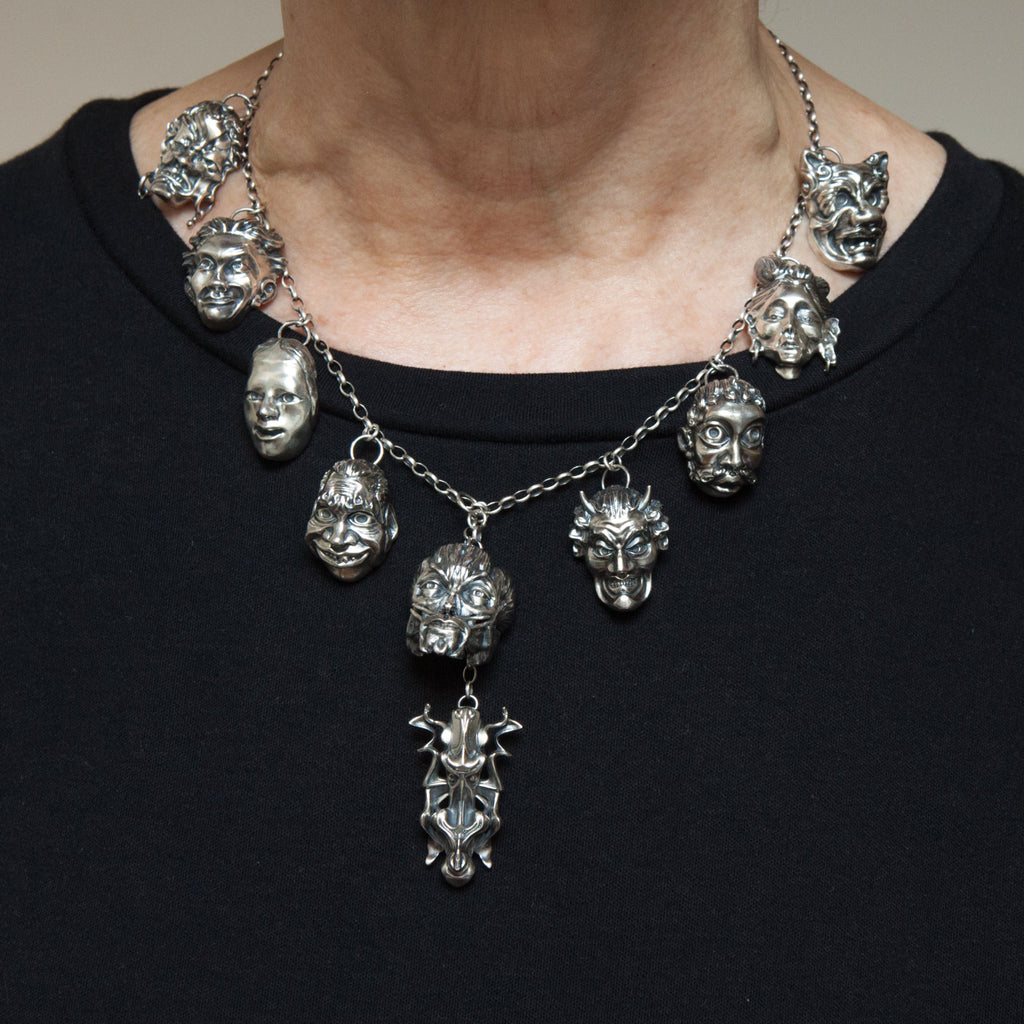 The sterling silver expressions necklace is shown being worn.