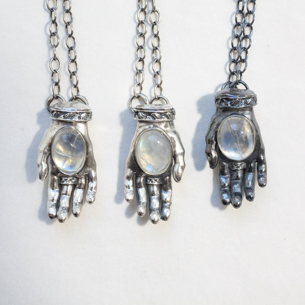 single offering and givinng hands , silver with rainbow moonstones