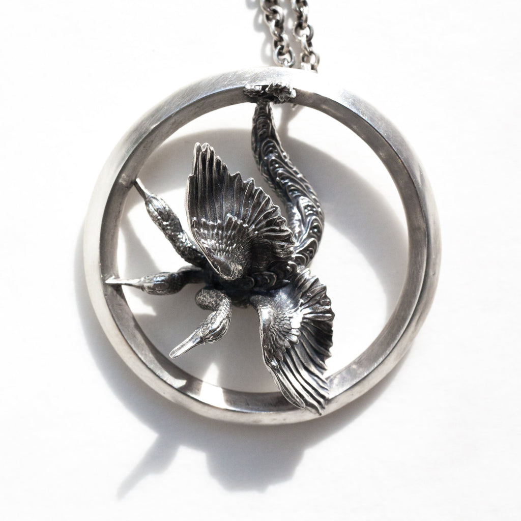 rhree-headed bird fom Bosch's Garden of Delight silver pendant, seen from the top