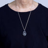 A very included topaz with sterling silver swallow and cloud setting. Worn.