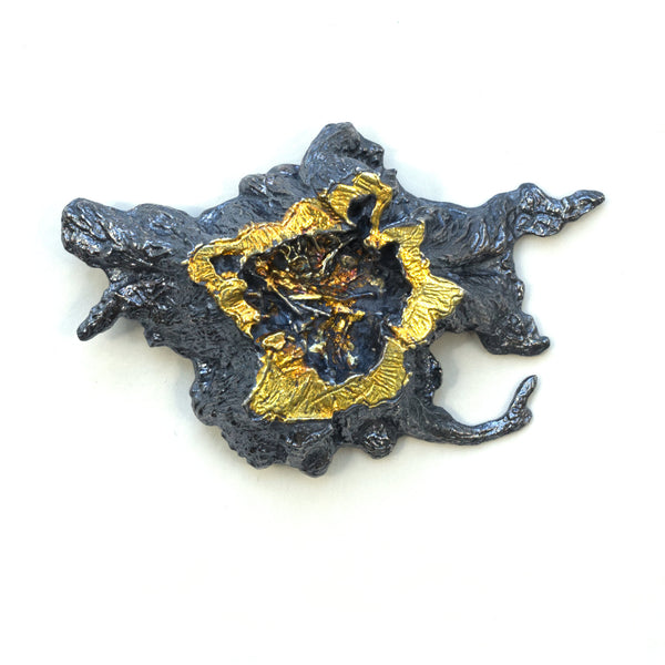 A photo scanned tree stump in blackened sterling silver with 24k gold foil fused using keum boo. A brooch, Front