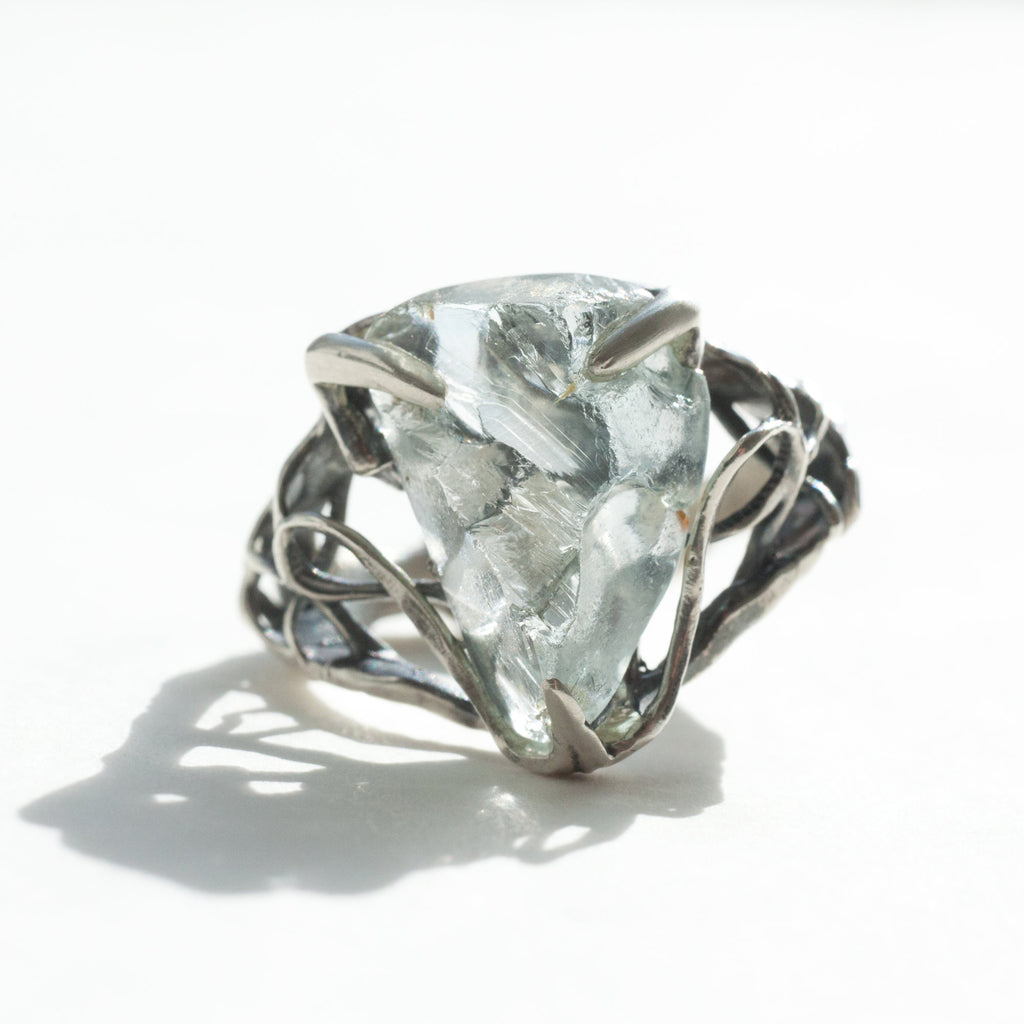 aquamarine triangle silver ring size 7 front view in a different kind of light