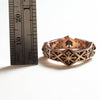 14k roes gold X band ring with the diamond pattern measure