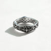 X-band sterling silver ring-cross pattern in a natural light