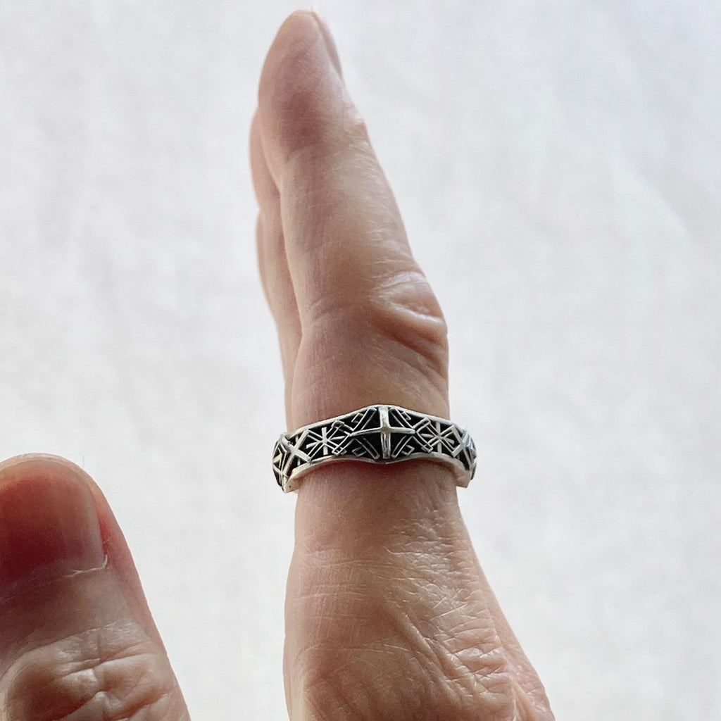 x-band sterling silver ring shown being worn from the side