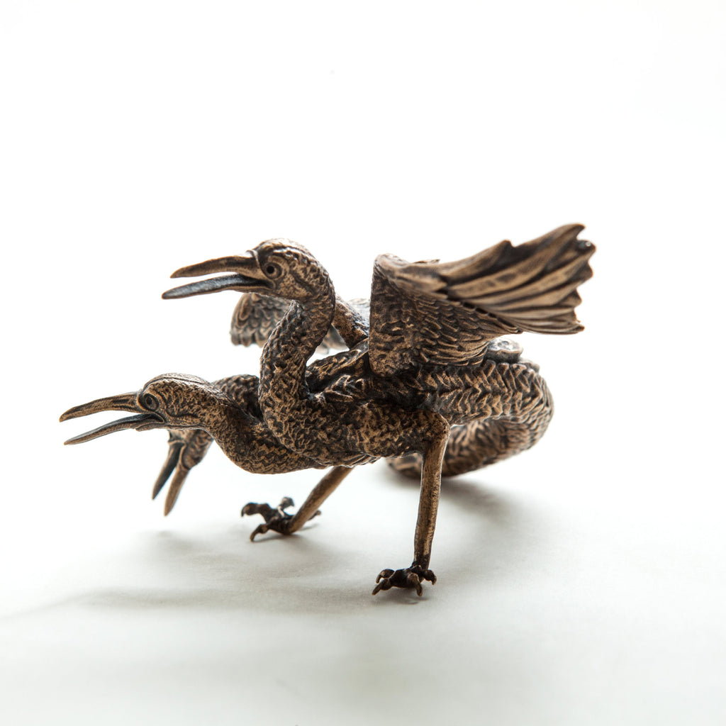 Bosch 3-headed bird, bronze sculpture heads