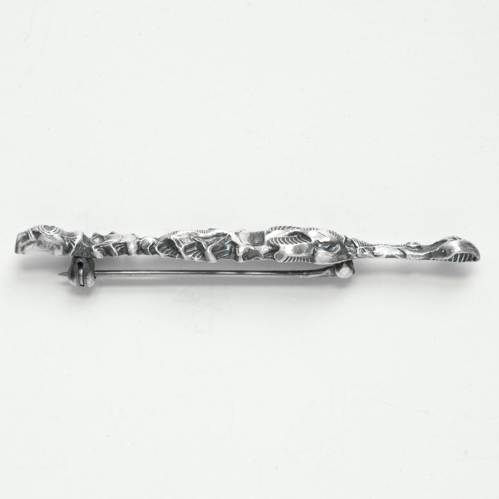 Alligator pin/Crocodile brooch, a stylized reflection in water-side