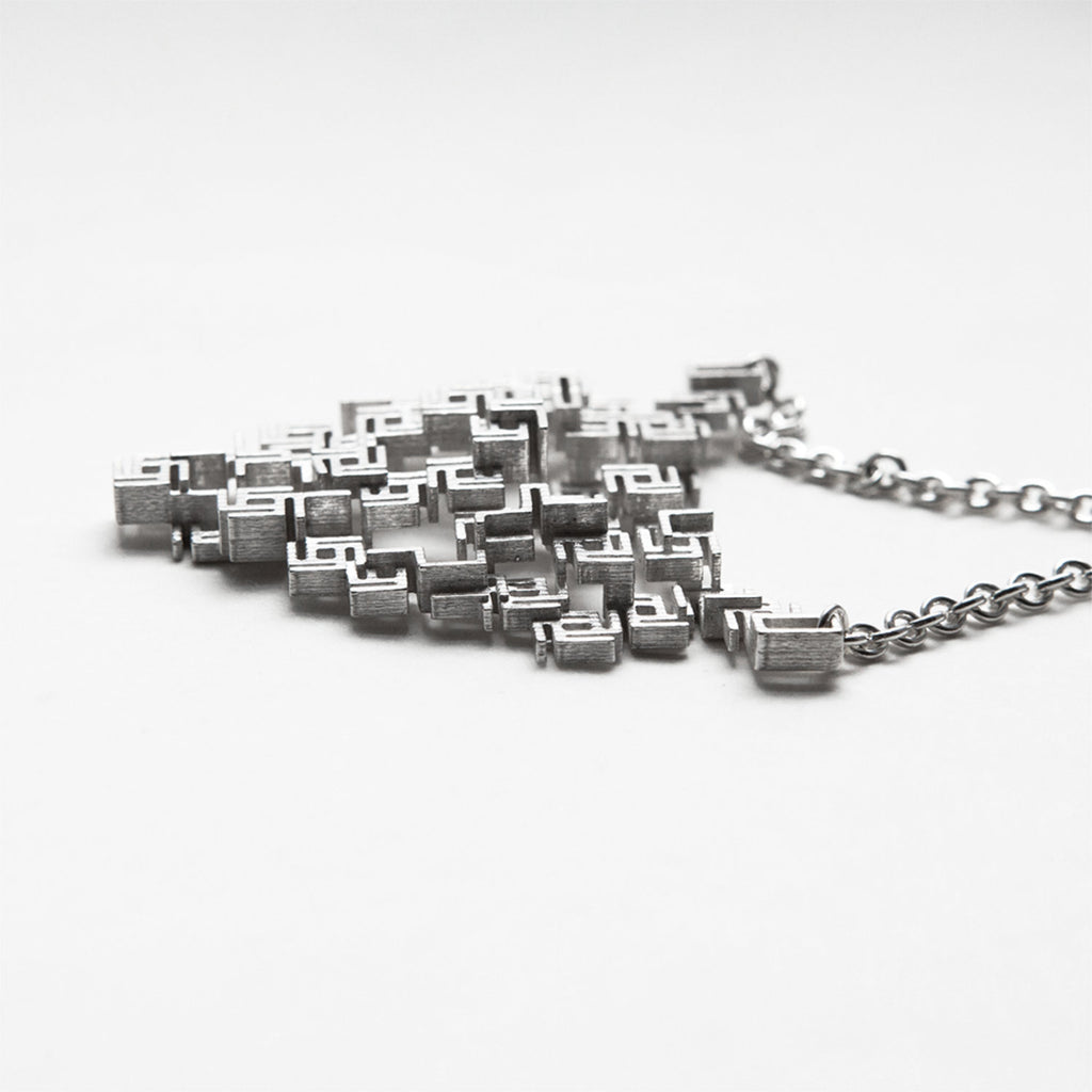 Bismuth patterned pendant with heart shape-left side