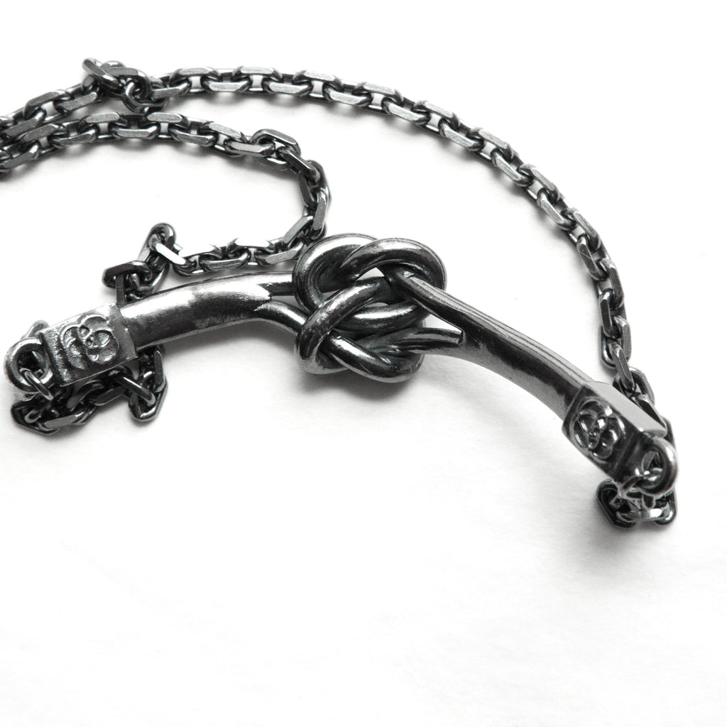 Double love knot or friendship knot darkened silver necklace-knot detail
