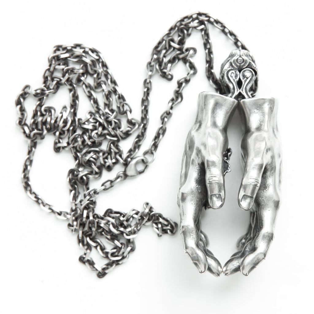 Hands with hidden flower silver pendant-front