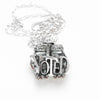 vote-offering-silver-pendant-front-of-hands