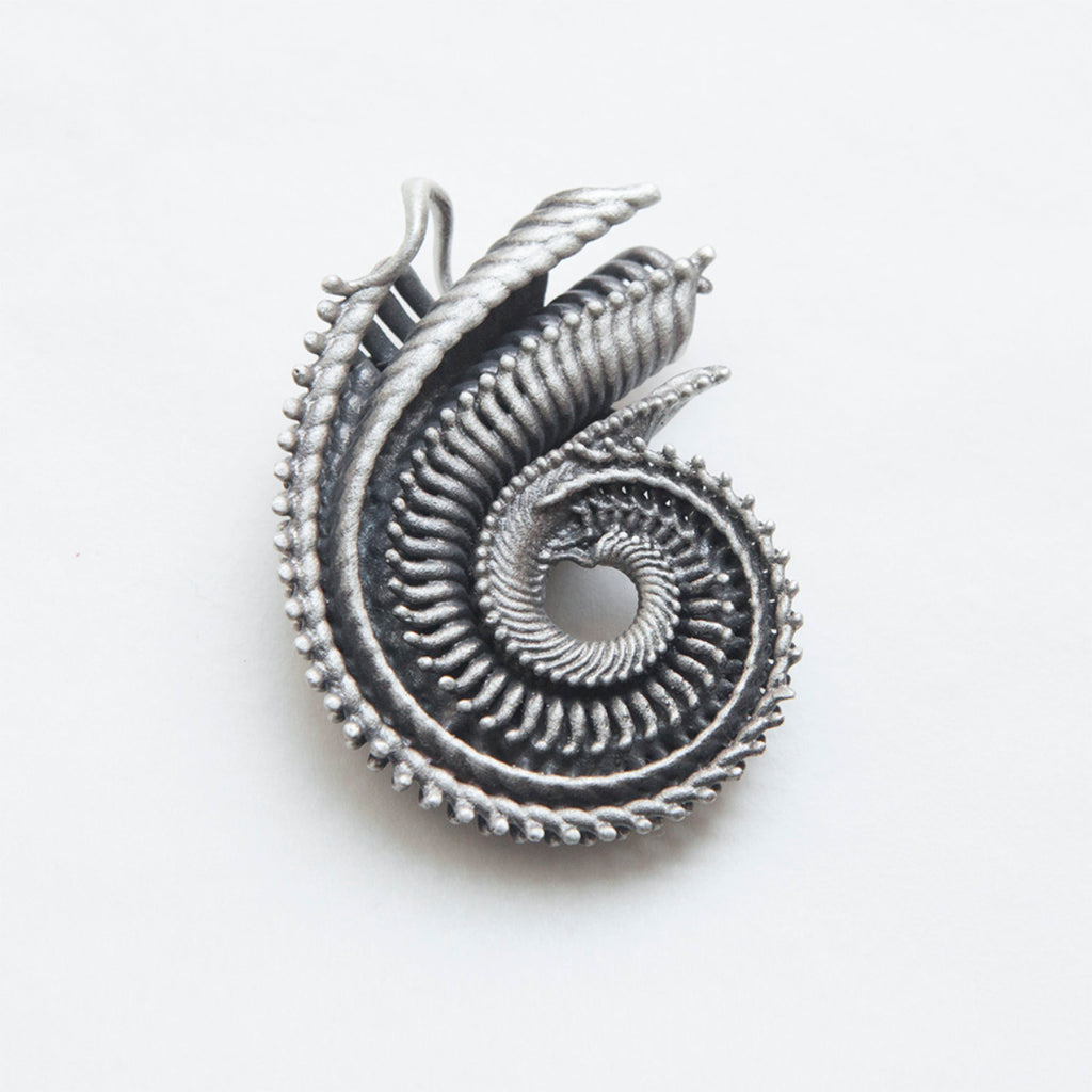 repeating abstract shell pattern silver pendant-back