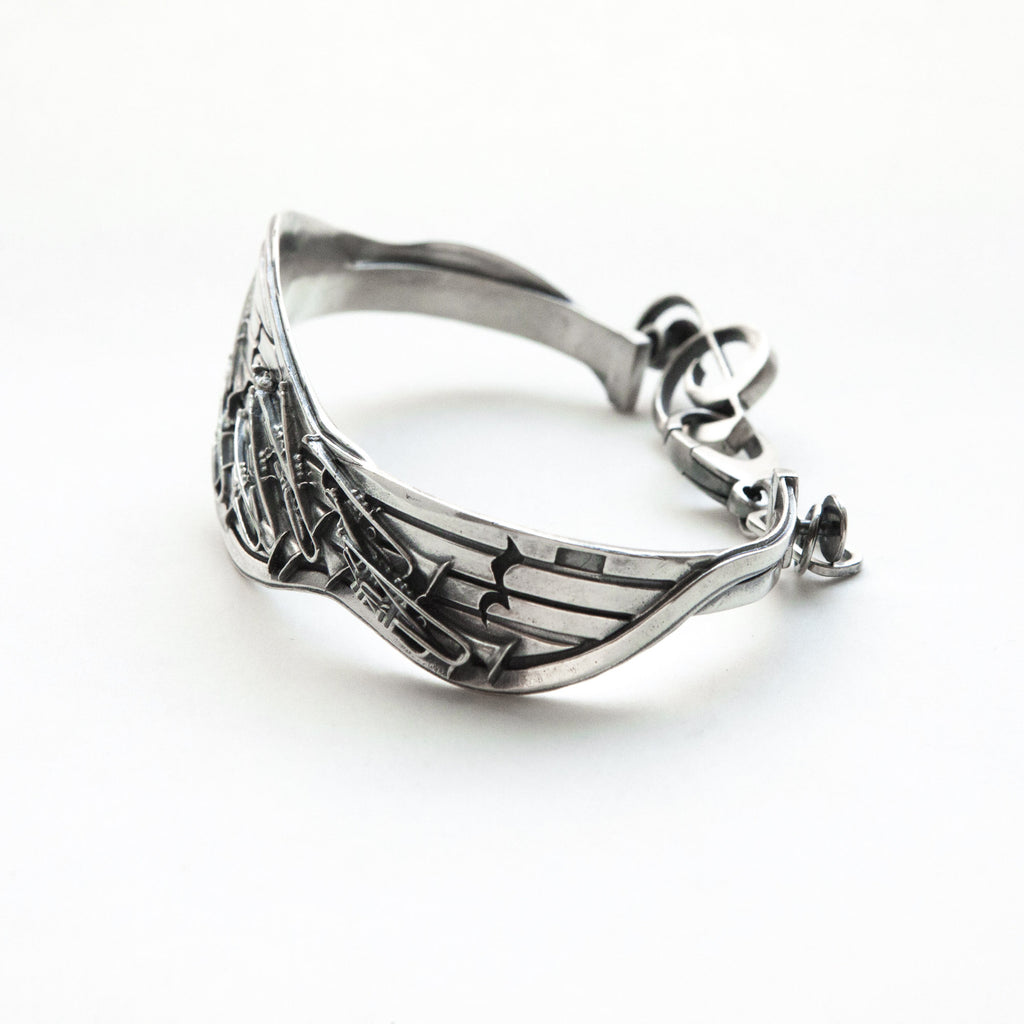 Miles Davis sterling silver cuff bracelet with treble clef clasp-left