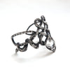 Nine endless knots infinity bracelet, for smaller wrists, silver cuff-side