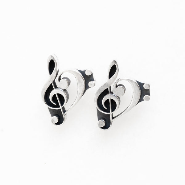 a combination of the treble and bass clefs silver earrings