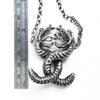 Twisting Love Snakes silver pendant with hidden hearts-measure